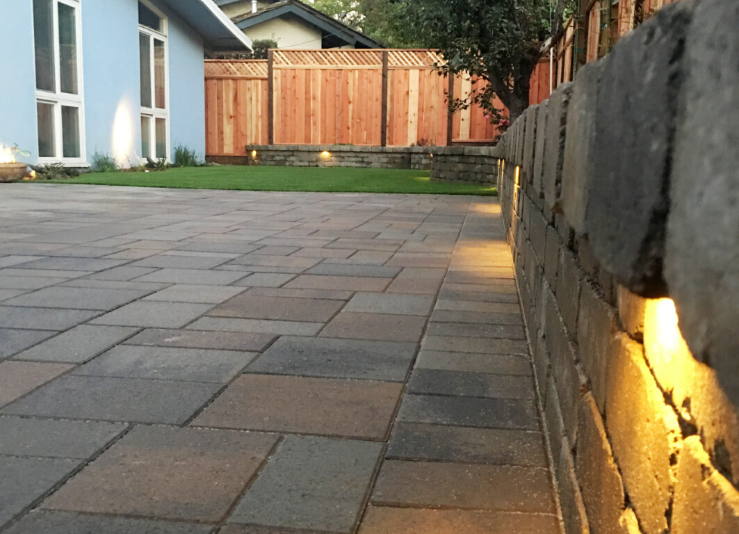 Professional concrete patio installation in Urbana, Illinois with decorative lighting